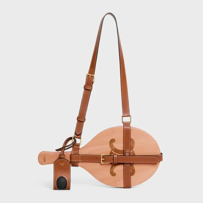 Beach Rackets in Wood and Calfskin Beach Rackets in Wood and Calfskin